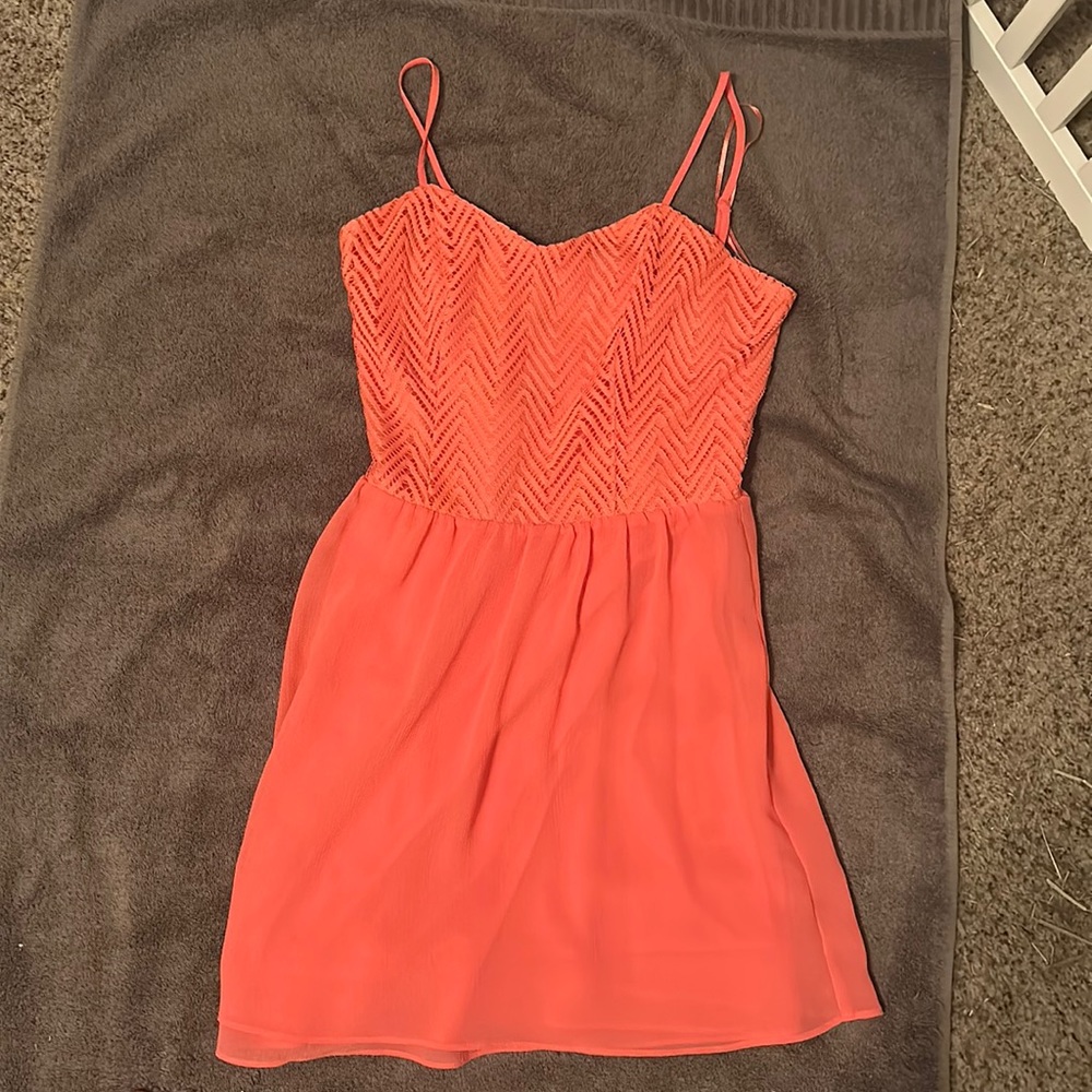 Coral colored sweetheart dress in size 3. Still has tags.